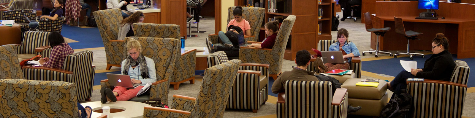 Wide shot of students working in library