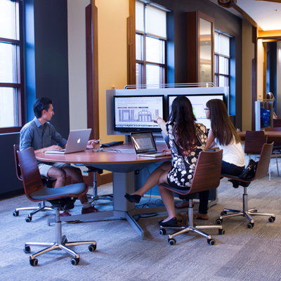 Group work table with students sharing a screen.